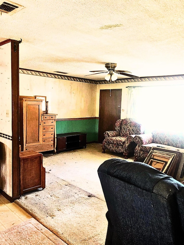 15672 Fm 3204, Brownsboro, TX 75756 - living area featuring a ceiling fan and a textured ceiling