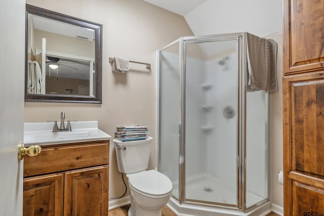 4831 Barclay Dr, Tyler, TX 75703 - bathroom with a shower stall, vanity, ceiling fan, and toilet
