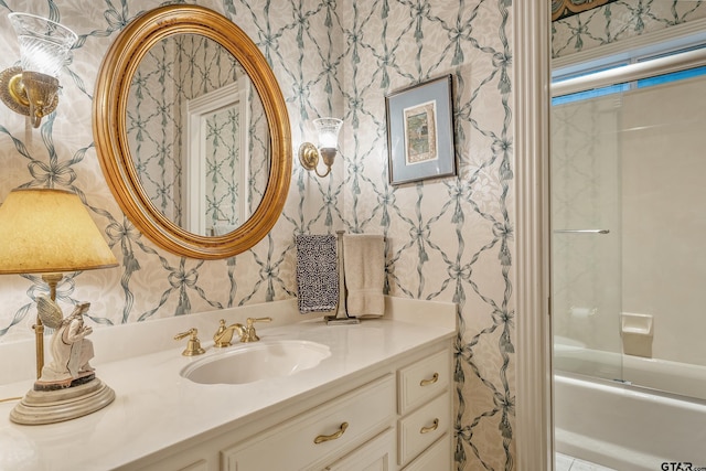 4831 Barclay Dr, Tyler, TX 75703 - bathroom featuring wallpapered walls, vanity, and bath / shower combo with glass door