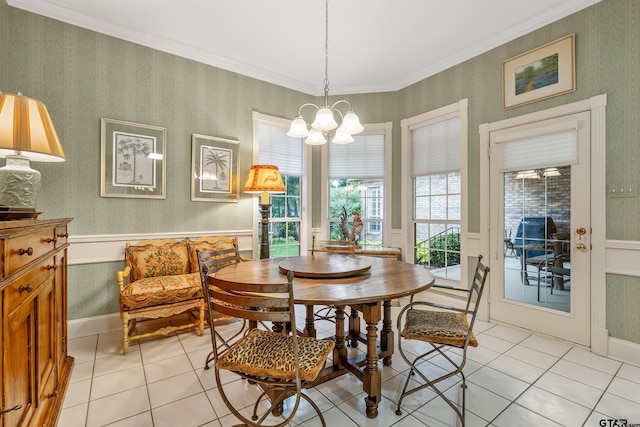 4831 Barclay Dr, Tyler, TX 75703 - dining room with light tile patterned floors, a chandelier, crown molding, wallpapered walls, and wainscoting