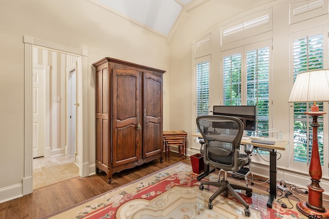 4831 Barclay Dr, Tyler, TX 75703 - office area with wood finished floors, lofted ceiling, plenty of natural light, and baseboards