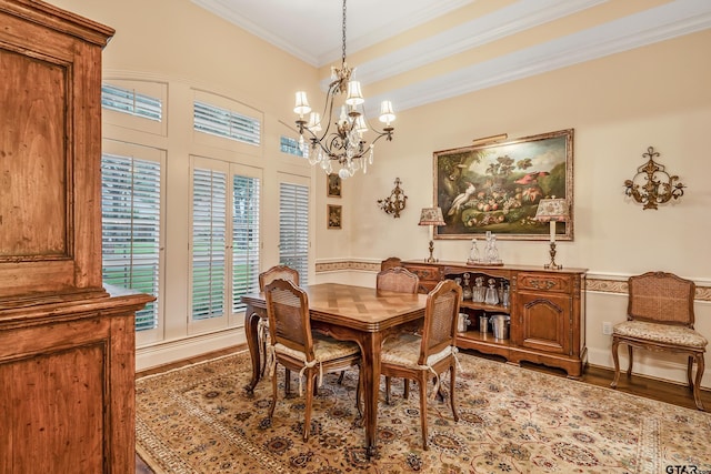 4831 Barclay Dr, Tyler, TX 75703 - dining area featuring crown molding, a chandelier, and wood finished floors
