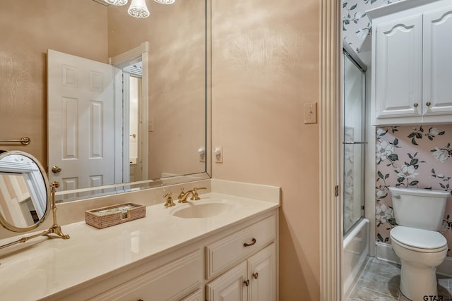 4831 Barclay Dr, Tyler, TX 75703 - full bathroom featuring toilet, vanity, bath / shower combo with glass door, and wallpapered walls