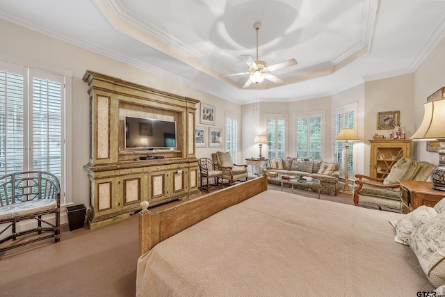 4831 Barclay Dr, Tyler, TX 75703 - bedroom with carpet flooring, crown molding, a tray ceiling, and ceiling fan