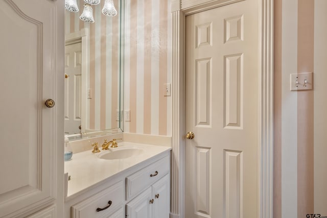 4831 Barclay Dr, Tyler, TX 75703 - bathroom featuring wallpapered walls and vanity