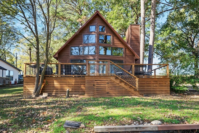 back of house featuring a wooden deck