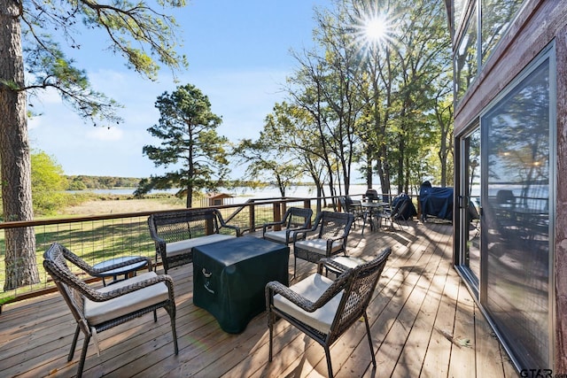 deck featuring a water view