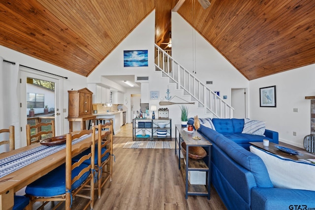 living room with hardwood / wood-style floors, ceiling fan, wooden ceiling, and high vaulted ceiling