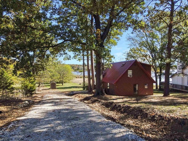 view of property exterior featuring a shed