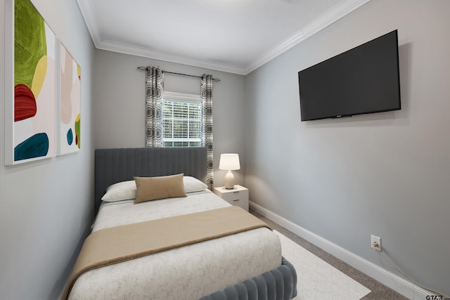 carpeted bedroom featuring ornamental molding