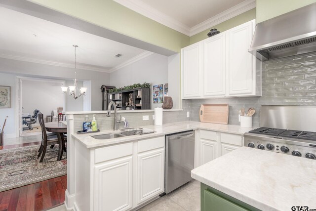 3363 Cascades Blvd, Tyler, TX 75709 - kitchen featuring dishwasher, wall chimney range hood, a sink, a peninsula, and light countertops