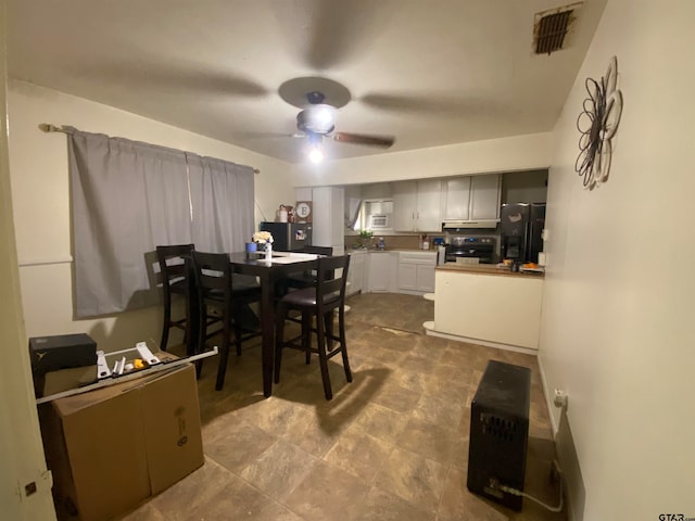 dining area featuring ceiling fan