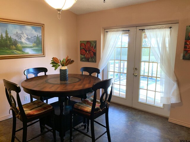 dining space featuring french doors