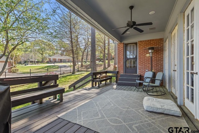 sunroom / solarium with ceiling fan