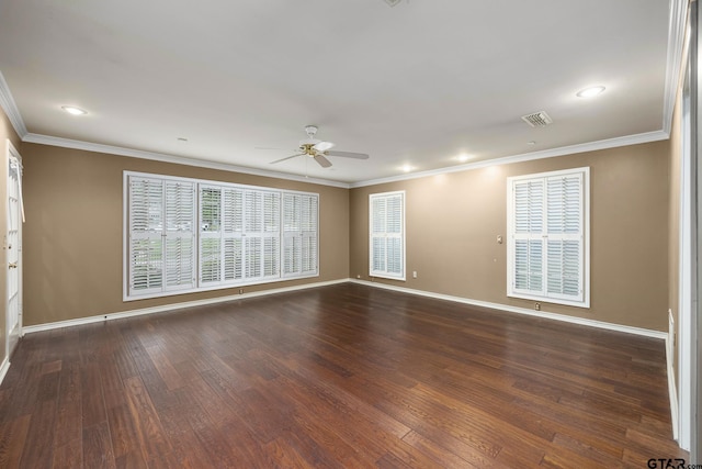 empty room with dark hardwood / wood-style flooring, ceiling fan, and crown molding