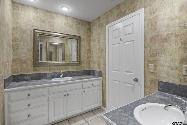 bathroom with tile patterned flooring and vanity