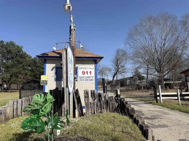exterior space featuring a gate and fence