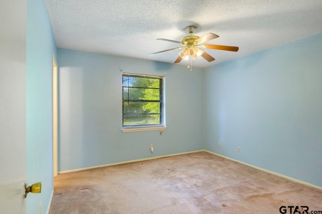 206 E Mims St, Tyler, TX 75702 - spare room with a textured ceiling, ceiling fan, carpet, and baseboards