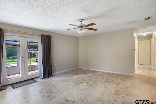 206 E Mims St, Tyler, TX 75702 - empty room with a ceiling fan, baseboards, french doors, and a textured ceiling