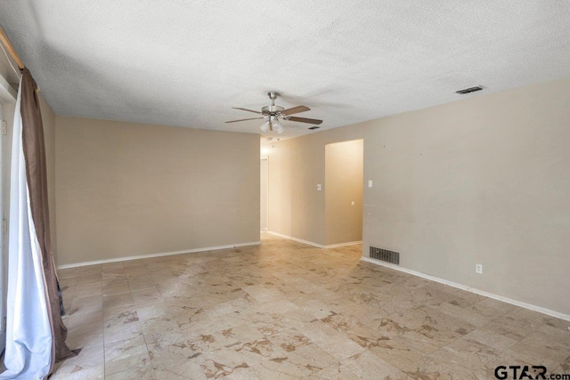 206 E Mims St, Tyler, TX 75702 - spare room featuring baseboards, visible vents, ceiling fan, and a textured ceiling