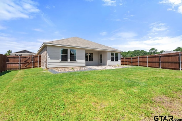 203 Parker Oaks Dr, Chandler, TX 75758 - back of property with a fenced backyard, a patio area, and roof with shingles