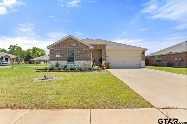 203 Parker Oaks Dr, Chandler, TX 75758 - view of front of home with brick siding, a garage, concrete driveway, a front lawn, and stone siding