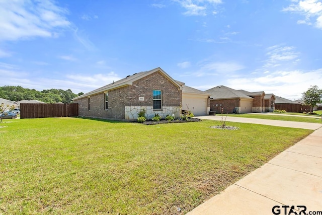 203 Parker Oaks Dr, Chandler, TX 75758 - single story home with brick siding, concrete driveway, and an attached garage