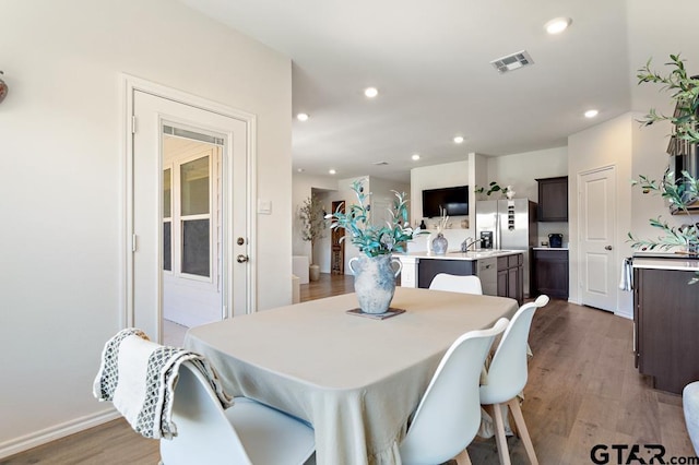 203 Parker Oaks Dr, Chandler, TX 75758 - dining space featuring wood finished floors and recessed lighting