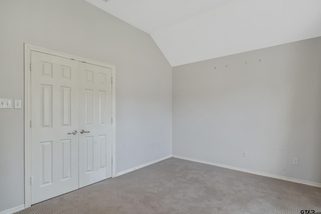 629 Whiteoak Ln, Tyler, TX 75703 - unfurnished bedroom with carpet floors, vaulted ceiling, and a closet