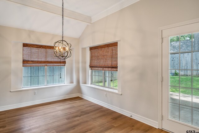 629 Whiteoak Ln, Tyler, TX 75703 - unfurnished dining area with a chandelier, lofted ceiling, wood finished floors, and ornamental molding