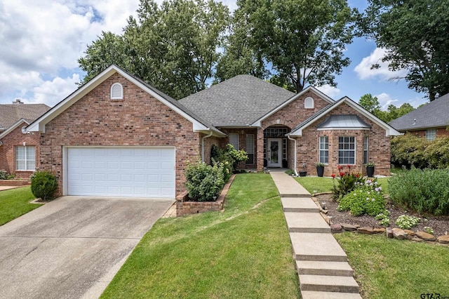 629 Whiteoak Ln, Tyler, TX 75703 - ranch-style house with an attached garage, brick siding, driveway, and a front yard