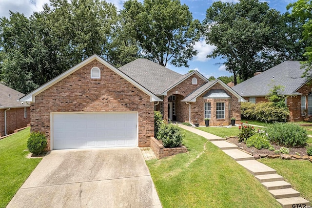 629 Whiteoak Ln, Tyler, TX 75703 - ranch-style house with brick siding, an attached garage, concrete driveway, and a front lawn