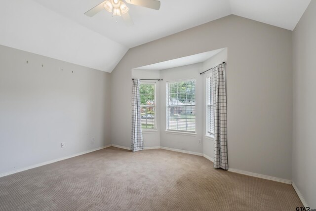 629 Whiteoak Ln, Tyler, TX 75703 - spare room with vaulted ceiling, carpet, and ceiling fan