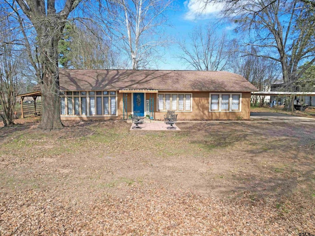 single story home featuring a carport