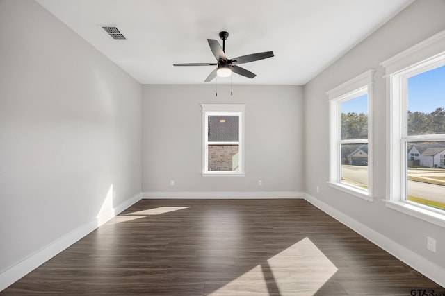 unfurnished room featuring dark hardwood / wood-style floors and ceiling fan