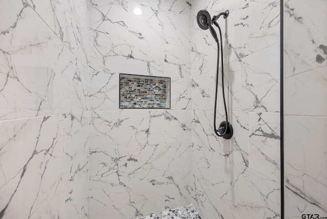 details with a tile shower