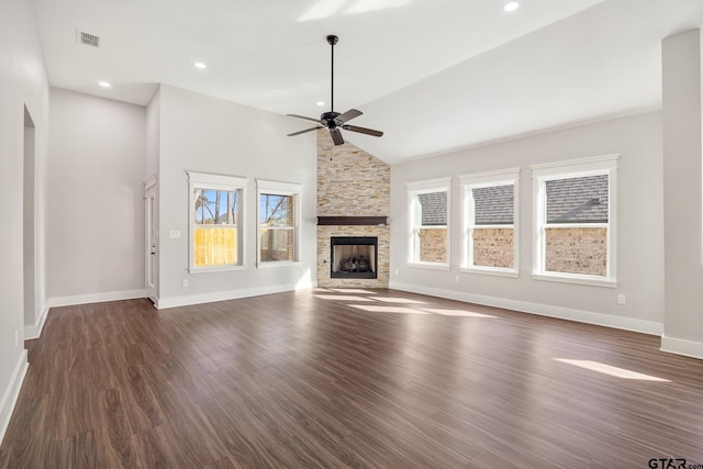 unfurnished living room with a fireplace, high vaulted ceiling, ceiling fan, and dark wood-type flooring