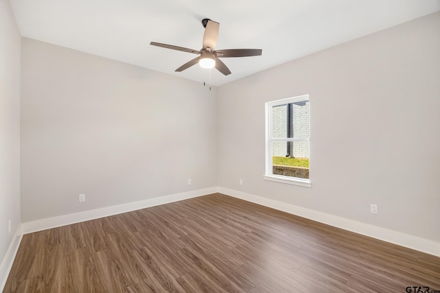 empty room featuring ceiling fan and wood-type flooring