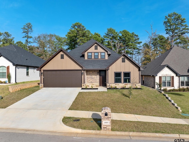 9161 Cave Branch Cv, Tyler, TX 75703 - view of front of home featuring board and batten siding, a garage, driveway, a shingled roof, and a front lawn