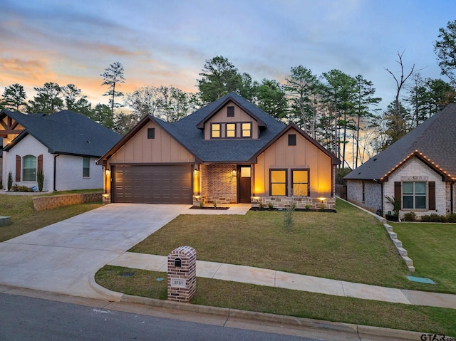 9161 Cave Branch Cv, Tyler, TX 75703 - view of front facade featuring board and batten siding, an attached garage, driveway, a front yard, and roof with shingles