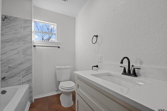 full bathroom with toilet, vanity, tiled shower / bath combo, and tile patterned floors