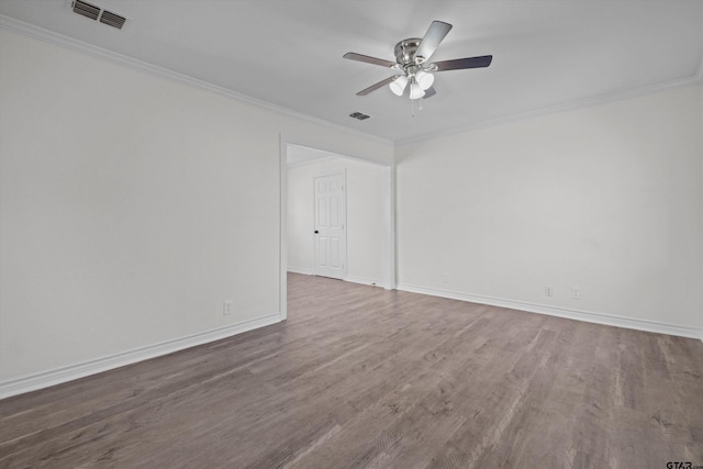 empty room with ceiling fan, ornamental molding, and wood-type flooring