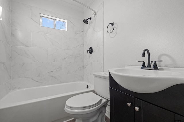 full bathroom with toilet, vanity, and tiled shower / bath