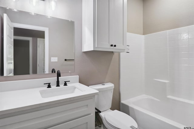 full bathroom featuring toilet, vanity, and  shower combination