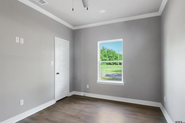 spare room with dark wood-type flooring, ceiling fan, and crown molding