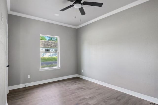 unfurnished room with ornamental molding, hardwood / wood-style floors, and ceiling fan