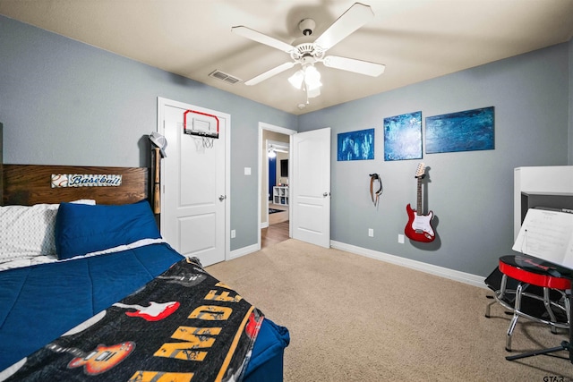 carpeted bedroom with ceiling fan, visible vents, and baseboards