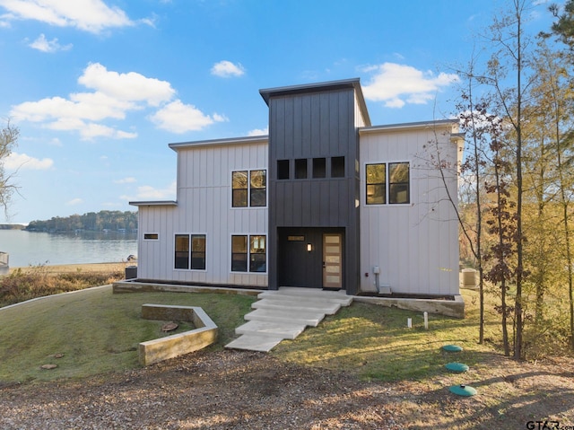 view of front of house featuring a water view and a front yard