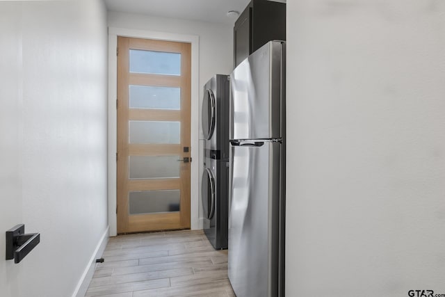 kitchen featuring stainless steel fridge and light hardwood / wood-style floors