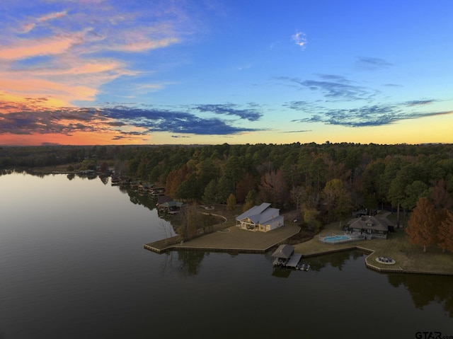 aerial view at dusk with a water view